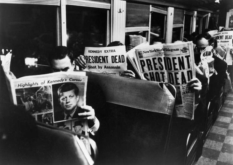 1963 | New York Commuters read of John F. Kennedy's assassination, November 1963. This Carl Mydans photo did not appear in LIFE when the magazine published as a weekly, but has been printed in later books.